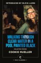 Walking Through Clear Water In a Pool Painted Black